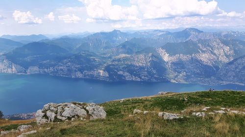 Scenic view of lake and mountains against sky