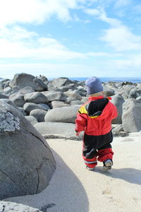 Person standing on rock formation