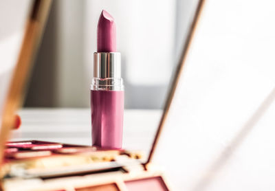 Close-up of lipstick on table