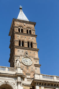 Low angle view of clock tower against sky