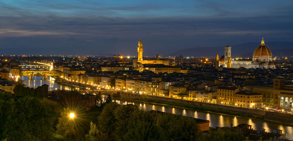 High angle view of illuminated city lit up at night