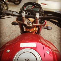 Close-up of motorcycle on road