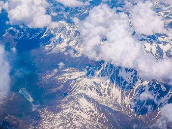 Aerial view of clouds over mountain