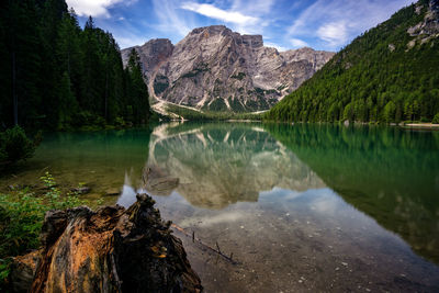 Scenic view of lake and mountains against sky