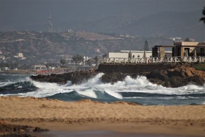 Scenic view of sea against mountain