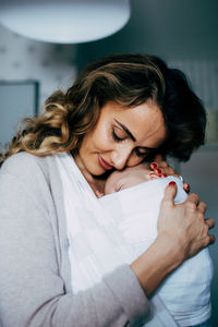 Close-up of beautiful woman at home