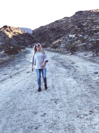 Portrait of woman walking on snow