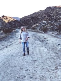 Portrait of woman walking on snow