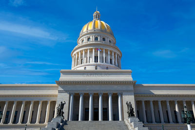 Low angle view of building against blue sky