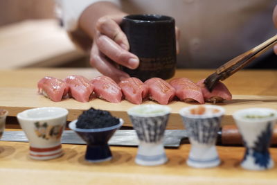 Close-up of preparing food on table