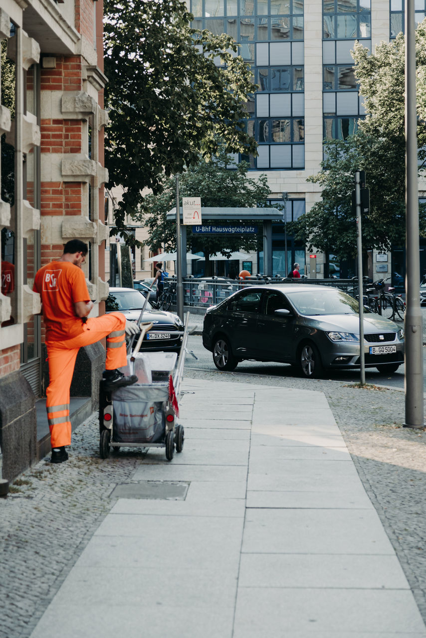 MAN WORKING ON CITY STREET