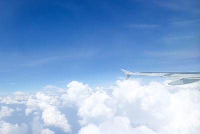 Low angle view of airplane flying in sky