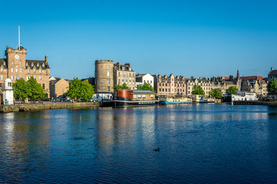 Buildings in distance with waterfront