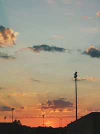 Low angle view of silhouette street light against sky during sunset