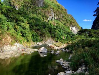 Scenic view of river and mountains