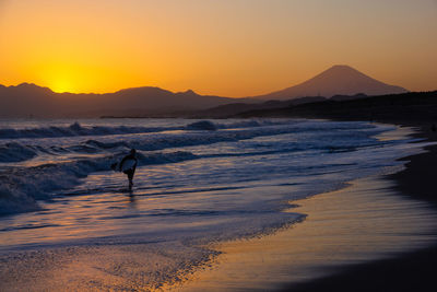 Scenic view of sea against sky during sunset