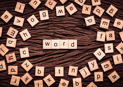 Directly above shot of wooden blocks with letters on table