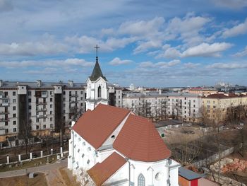 Buildings in town against sky