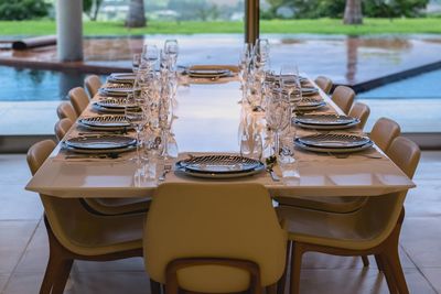 Close-up of empty chairs and tables at restaurant