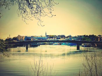 Bridge over river at sunset