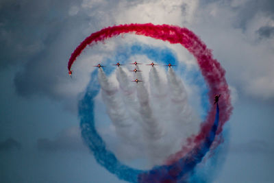 Airplane flying against sky