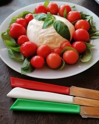 High angle view of tomatoes in plate on table