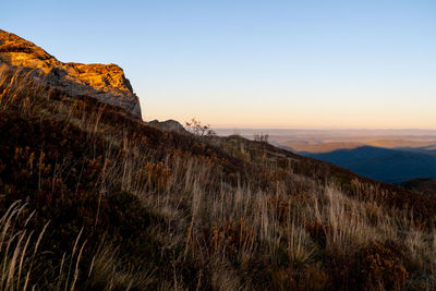 Scenic view of rocky mountains against sky during sunset