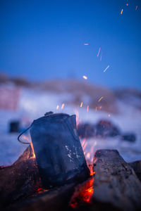 Close-up of fire against the sky