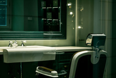 View of illuminated bathroom in barber shop