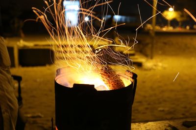 Close-up of fire burning at night