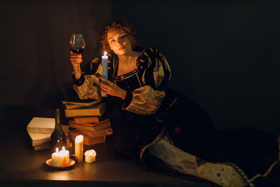 Portrait of woman playing chess at home