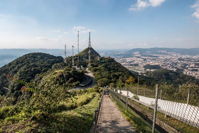 Panoramic view of cross on mountain against sky