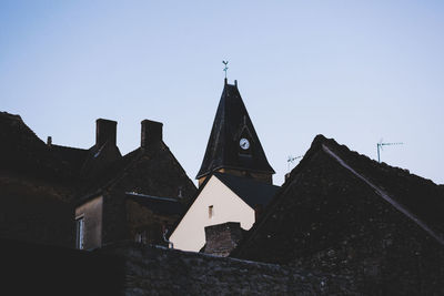 Low angle view of buildings against clear sky