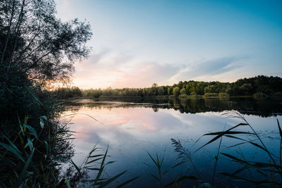 Scenic view of lake against sky during sunset