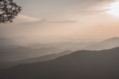 Scenic view of silhouette mountains against sky during sunset