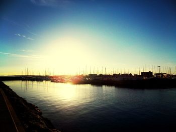 View of harbor at sunset