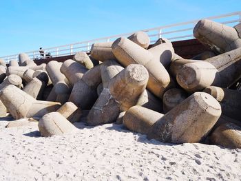 Stack of rocks on beach against clear sky