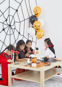 Group of people sitting on table