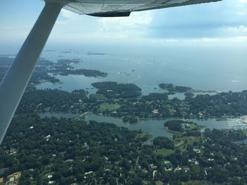 Aerial view of sea seen through airplane window