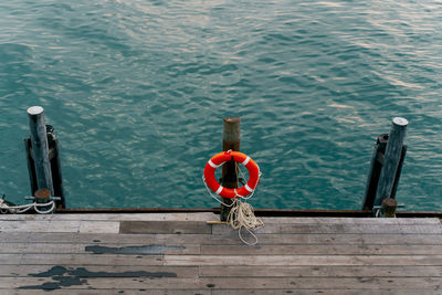 High angle view of man on pier over sea