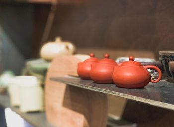 Close-up of chinese tea pots on a shelf