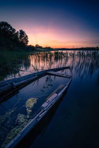 Broken boat at lakeside