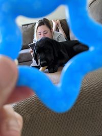 Man with dog relaxing on bed