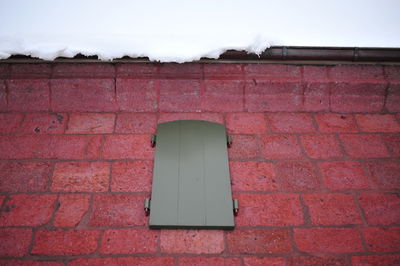 Red brick wall against sky