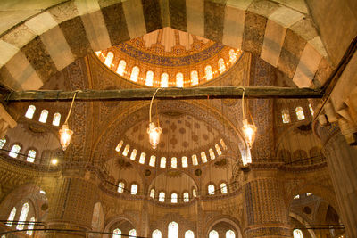 Low angle view of illuminated ceiling in building