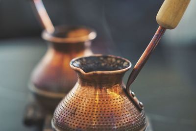 Close-up of copper containers