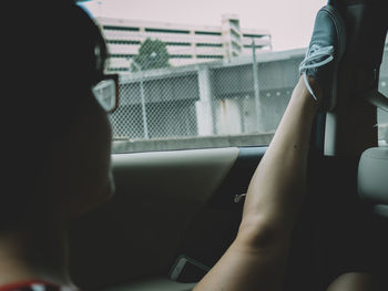 Rear view of people sitting in car