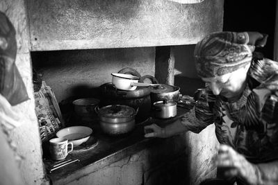 Senior woman looking down in kitchen