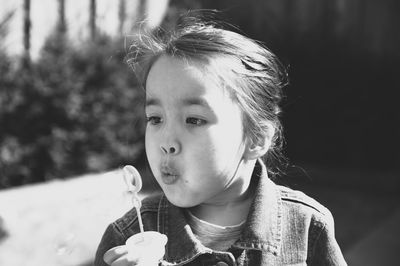 Close-up portrait of a girl eating ice cream