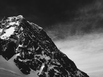 Scenic view of snow covered mountains against sky